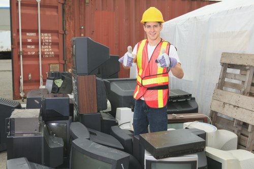 Collection crew setting up recycling bins in Willesden high street